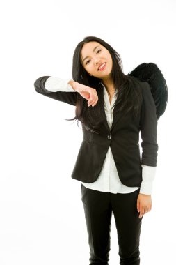 Asian young businesswoman dressed up as black angel pretending to leaning
