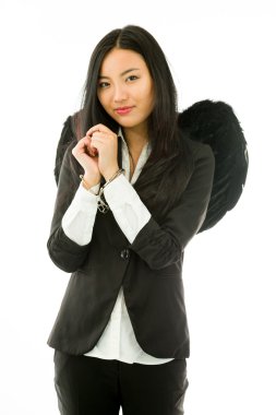 Asian young businesswoman dressed up as black angel handcuffs isolated on white background