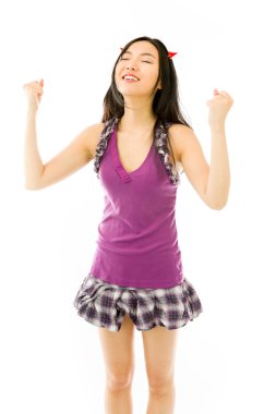 Asian young woman dressed up as a devil  celebrating her success with fist isolated on white background
