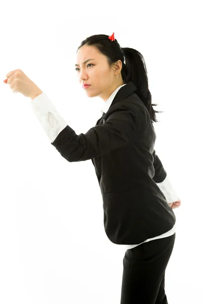 Devil side of a young Asian Businesswoman punching with fist isolated on white background isolated on white background — Stok fotoğraf