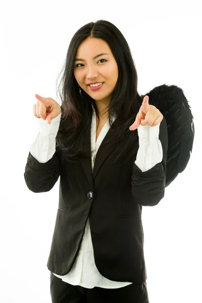 Asiática jovem empresária vestida como anjo preto apontando para você de ambas as mãos isoladas no fundo branco — Fotografia de Stock