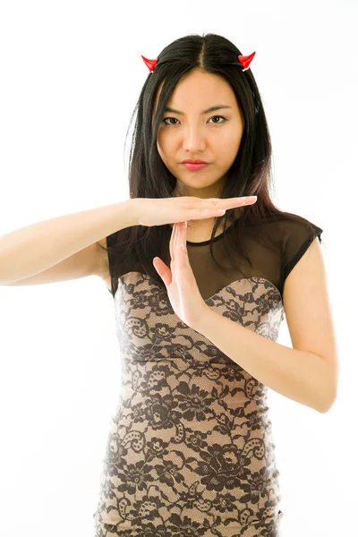 Asian young woman dressed up as a devil  and making time out signal with hands isolated on white background — Stock Photo, Image