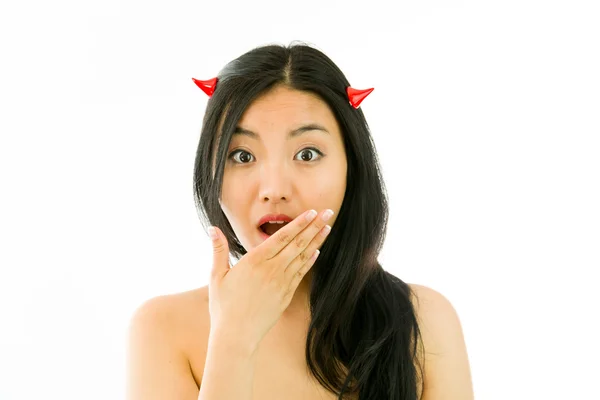 Devil side of a young naked Asian woman looking shocked — Stock Photo, Image