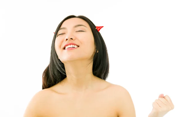 Diabo lado de uma jovem mulher asiática nua comemorando o sucesso com punho para cima — Fotografia de Stock