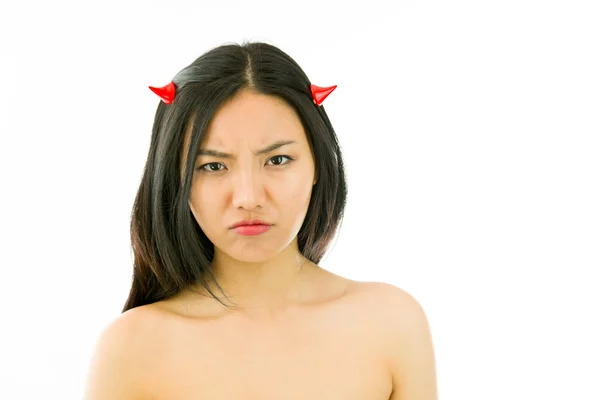 Devil side of a young naked Asian woman looking sad — Stok fotoğraf