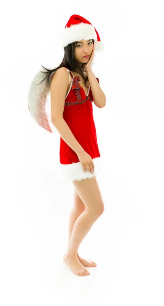 Upset Asian young woman wearing Santa costume dressed up as an angel with her hands on cheek — Stock Fotó