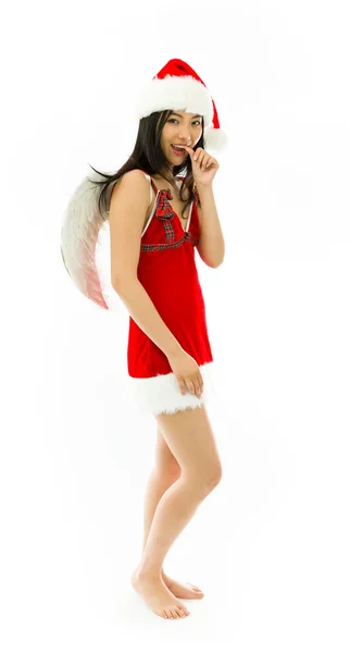 Asian young woman wearing Santa costume dressed up as an angel with finger in mouth isolated on white background — Stock Photo, Image