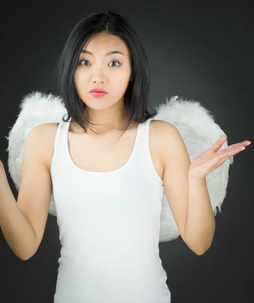 Asian young woman dressed up as an angel dont know what to do — Stock Photo, Image