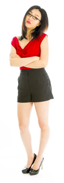 Young woman standing with her arms crossed — Stock Photo, Image