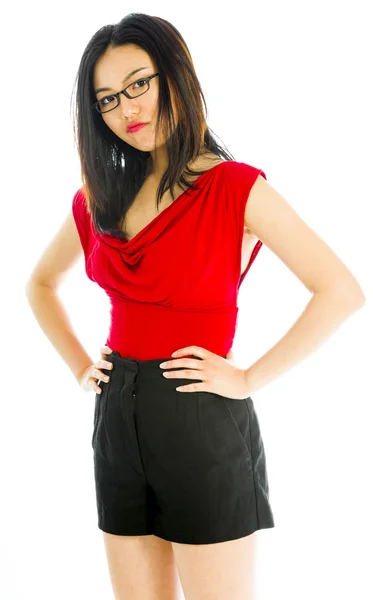 Young woman standing with her arms akimbo — Stock Photo, Image