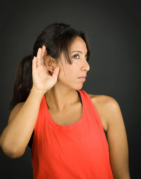 Close up of a young woman hand to ear listening carefully — Stock Photo, Image