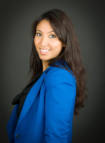 Side view of a young businesswoman smiling — Stock Photo, Image