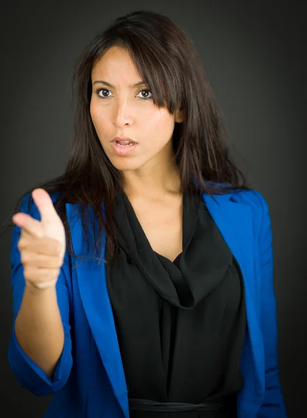 Angry young businesswoman scolding somebody — Stock Photo, Image
