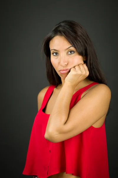 Upset young woman with her hands on cheek — Stock Photo, Image