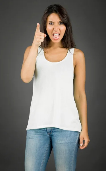 Angry and irratated young woman scolding to somebody — Stock Photo, Image