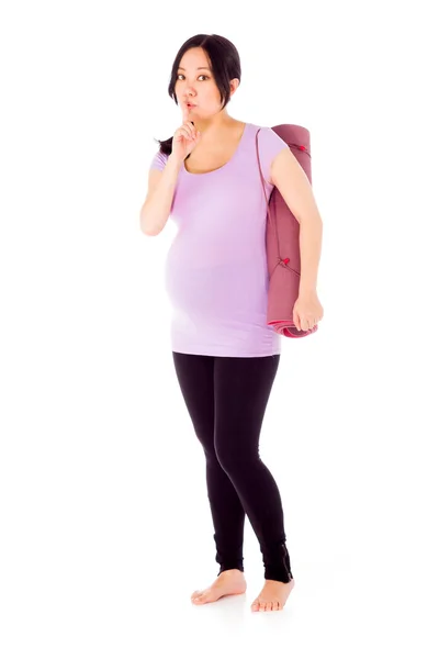 Pregnant woman gesturing silence sign — Stock Photo, Image