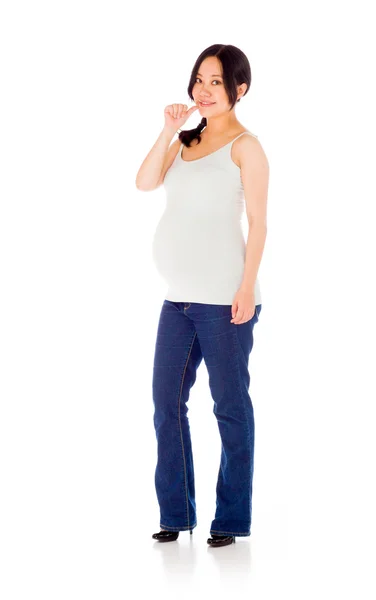 Беременная женщина нервно кусает палец — стоковое фото