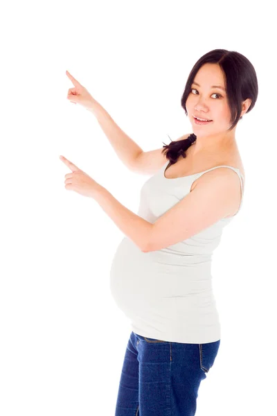 Pregnant woman pointing left — Stock Photo, Image