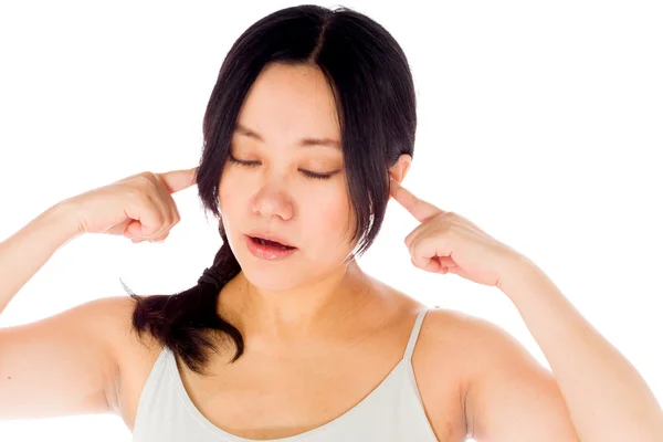 Pregnant woman plugging her ears — Stock Photo, Image