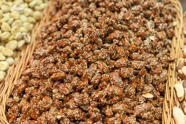 Sesame seed coated nuts on sale at a market stall, La Boqueria Market, Barcelona, Catalonia, Spain — Stock Photo, Image