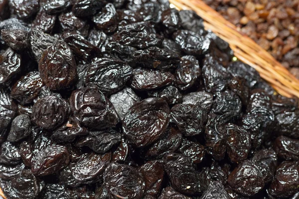 Dried plums for sale at a market stall, La Boqueria Market, Barcelona, Catalonia, Spain — Stock Photo, Image