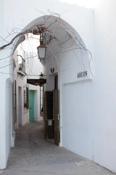 Empty narrow alley along houses — Stock Photo, Image