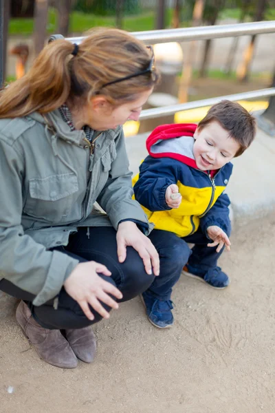 Small boy playing with his mother — Stock Photo, Image
