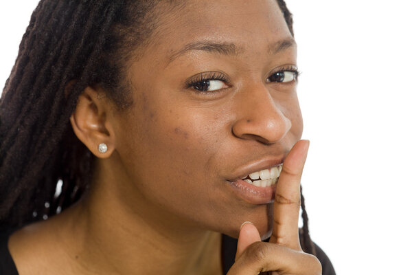 Model with  fingers on lips