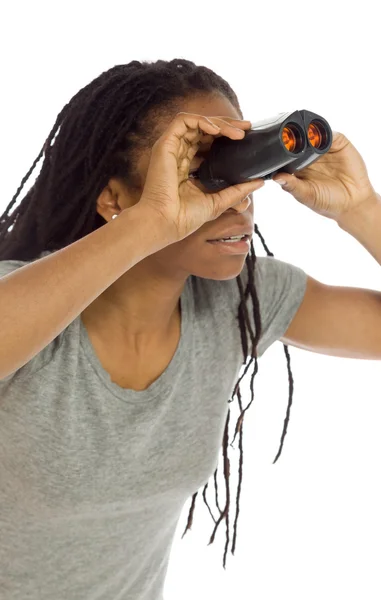 Model looks through binoculars — Stock Photo, Image