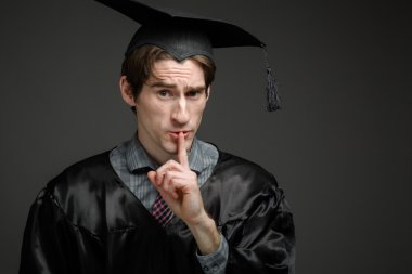 Model holds fingers on lips