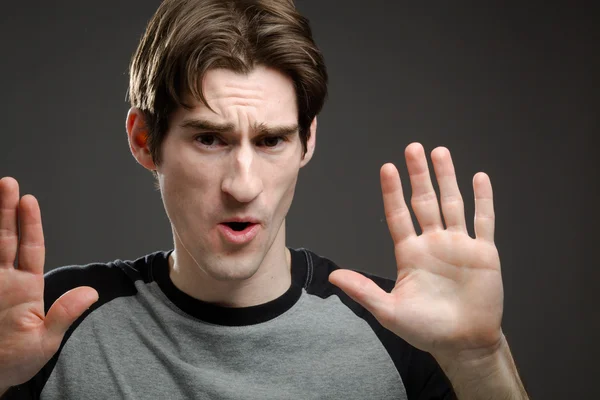 Model gesturing stop sign with hands — Stock Photo, Image