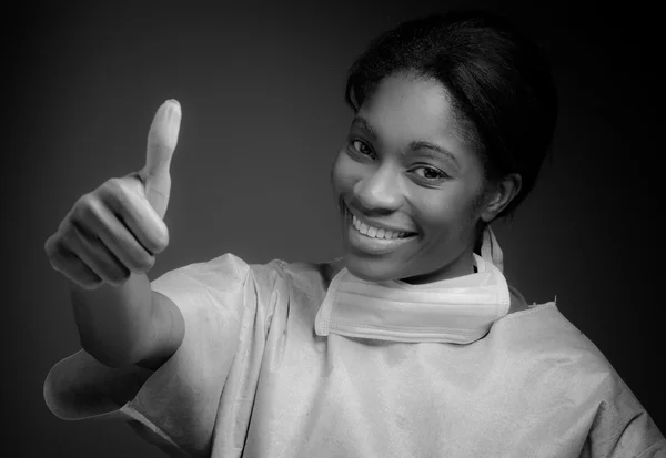 Model gesturing thumb up sign — Stock Photo, Image