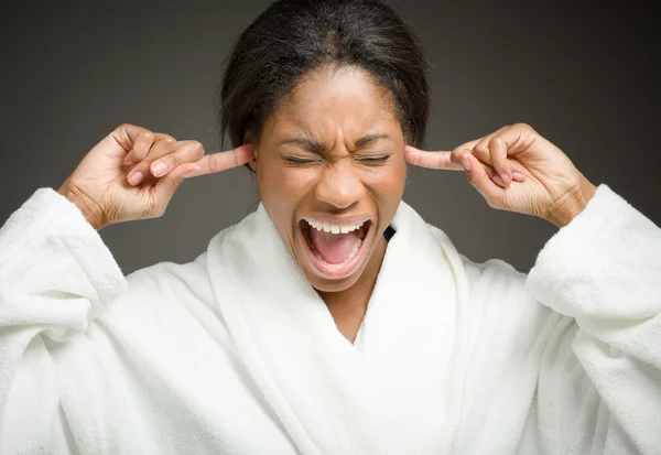 Model plugging ears with fingers — Stock Photo, Image