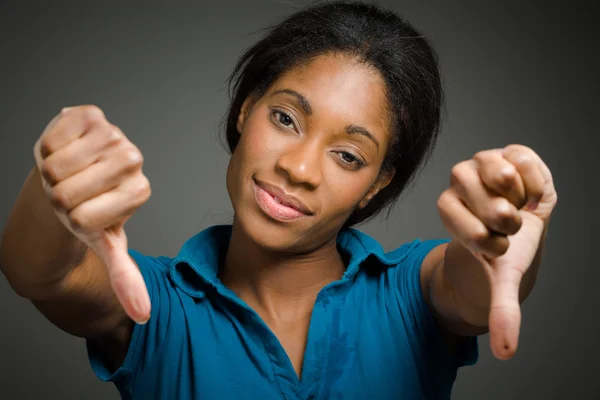 Model gesturing thumbs down — Stock Photo, Image