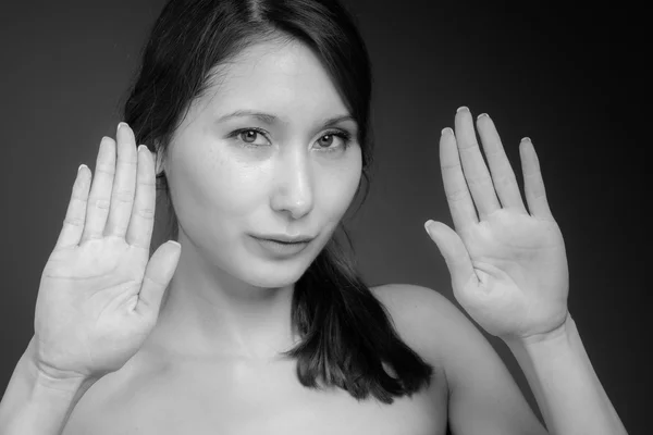 Model gesturing stop sign with hands — Stock Photo, Image