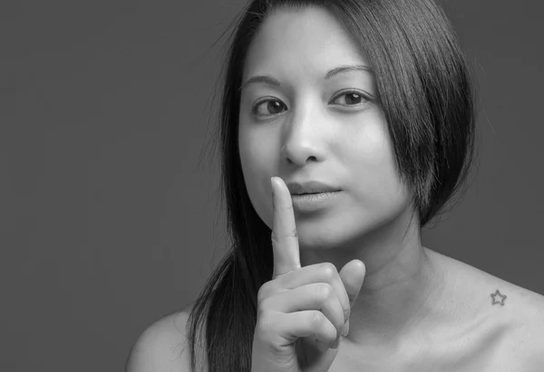 Model with a  finger on lips — Stock Photo, Image