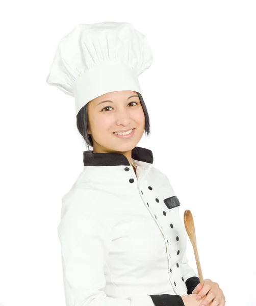 Жіночий шеф-кухар з дерев'яною дружиною — стокове фото
