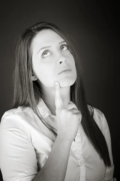 Model thinking with hand under chin — Stock Photo, Image