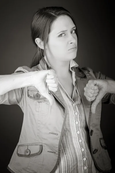 Model gesturing tommelfingre ned - Stock-foto