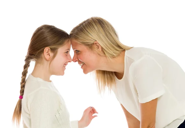 Mother and daughter looking in eyes Stock Picture