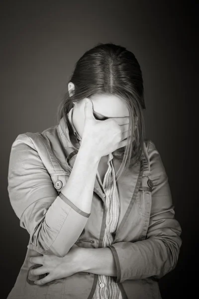 Model ashamed hiding face in hand — Stock Photo, Image