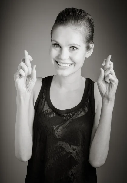 Model with fingers crossed for luck — Stock Photo, Image