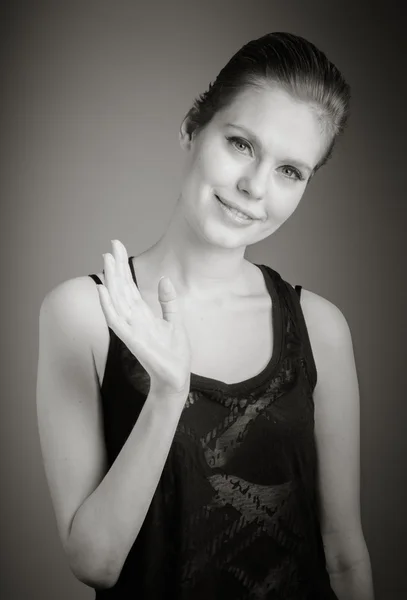 Woman waving by hand — Stock Photo, Image