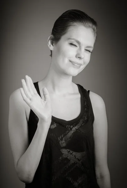 Woman waving by hand — Stock Photo, Image