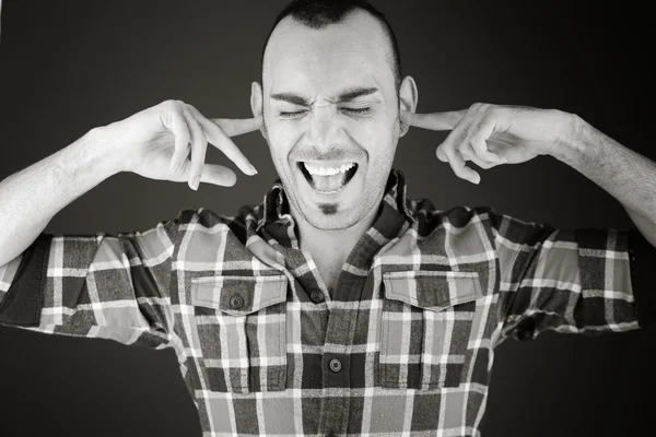 Model plugging ears with fingers — Stock Photo, Image