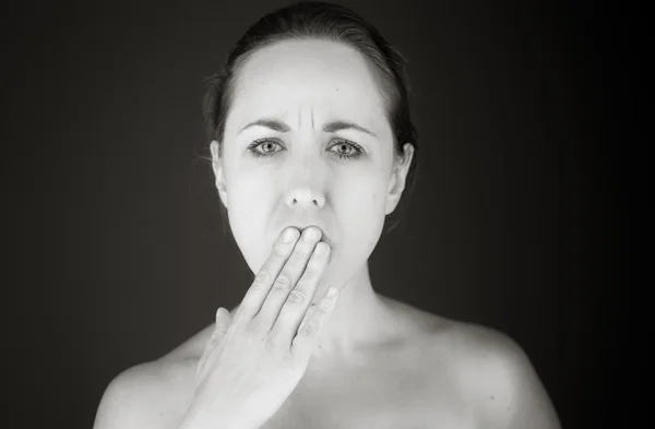 Model covering mouth by hand — Stock Photo, Image