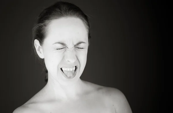 Model sticking tongue out — Stock Photo, Image