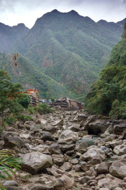 Town of Aguas Calientes in the Andes Mountains clipart