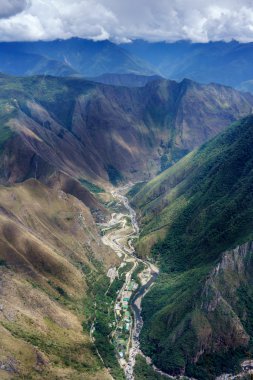 Urubamba river flowing through green Andes clipart