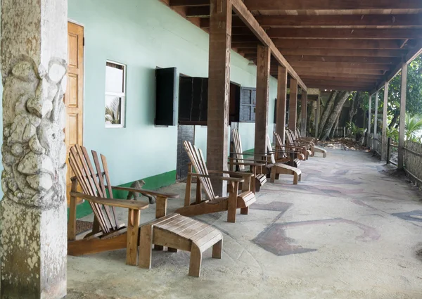 Adirondack chairs in porch of a tourist resort — Stock Photo, Image